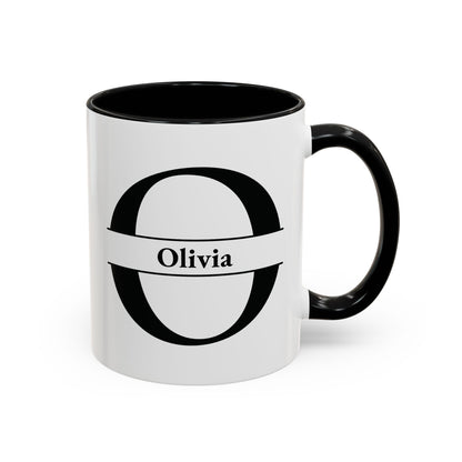 An accent color 11oz ceramic mug with a black interior, black handle, and a black graphic of a stylized letter Q with a banner reading 'Quentin' on the front. Right handle view.