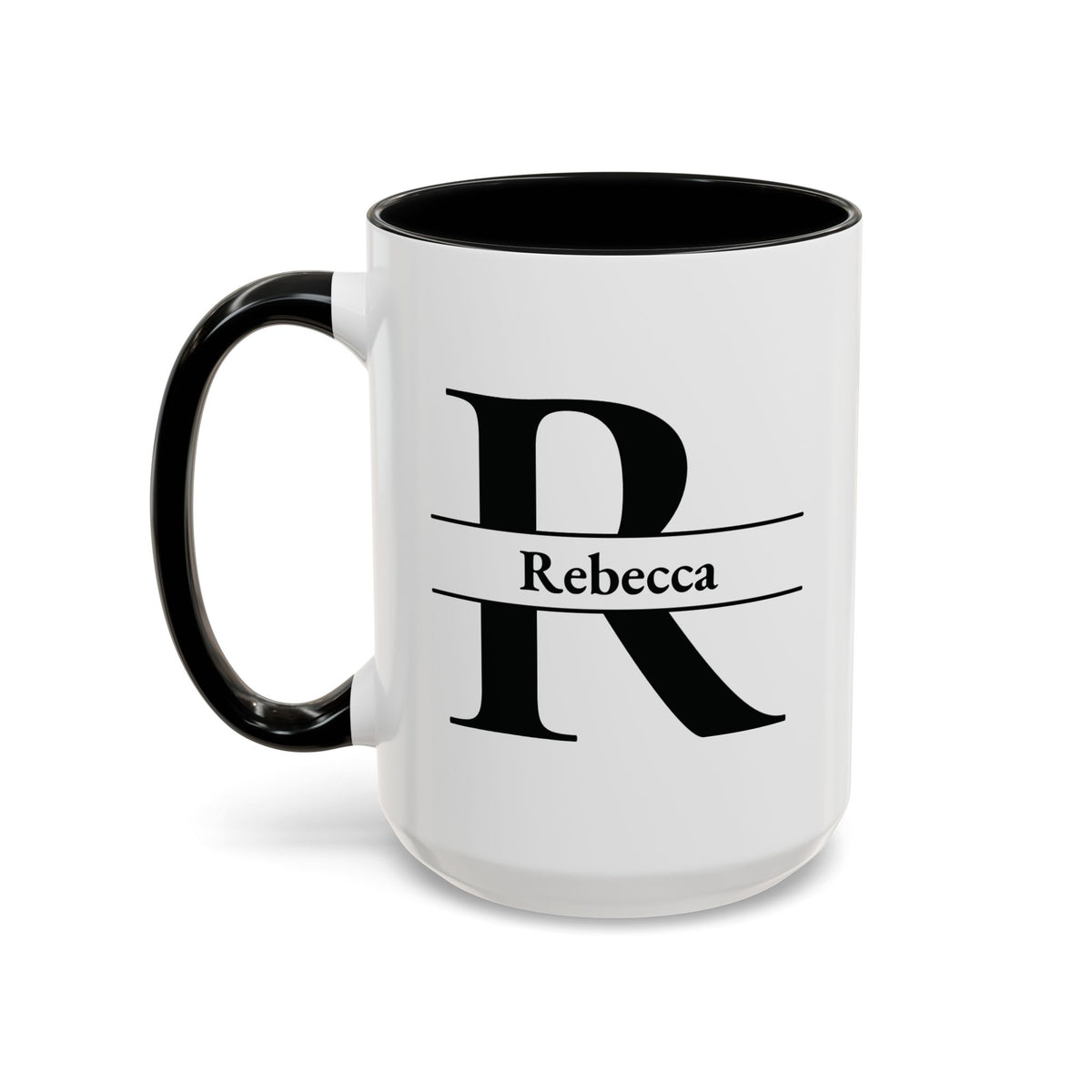 An accent color 15oz ceramic mug with a black interior, black handle, and a black graphic of a stylized letter R with a banner reading 'Rebecca' on the front. Left handle view.