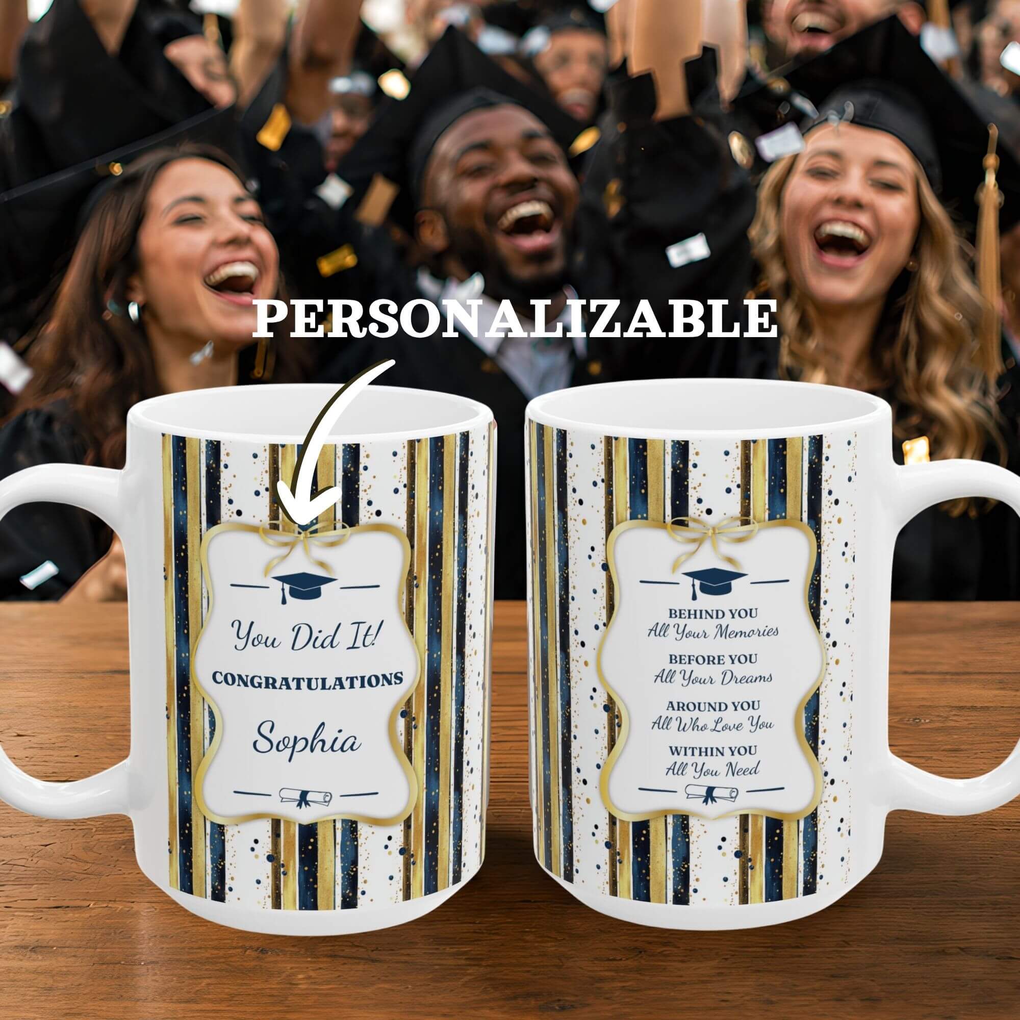 Personalizable graduation-mugs with personalized text on a wooden surface, surrounded by students in graduation caps and gowns.