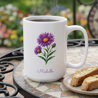 Aster birth flower personalized ceramic mug, styled on a garden table with two biscotti on a plate and flowers in background.