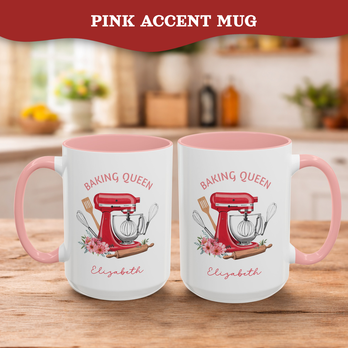 Two white ceramic 15oz mugs with pink interiors and handles, displayed side by side on a wooden table. Each mug features a printed illustration of a red stand mixer, baking utensils, flowers, and the text 'BAKING QUEEN Elizabeth'.