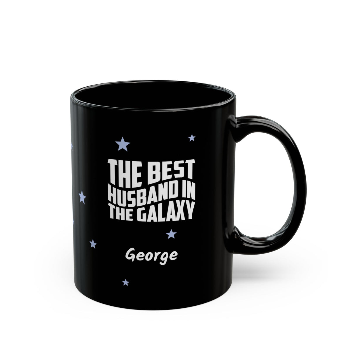 Black 11oz mug with small light blue stars and white text 'Best Husband in the Galaxy' with a personalize name below. Right handle view. Mug is placed on a white background