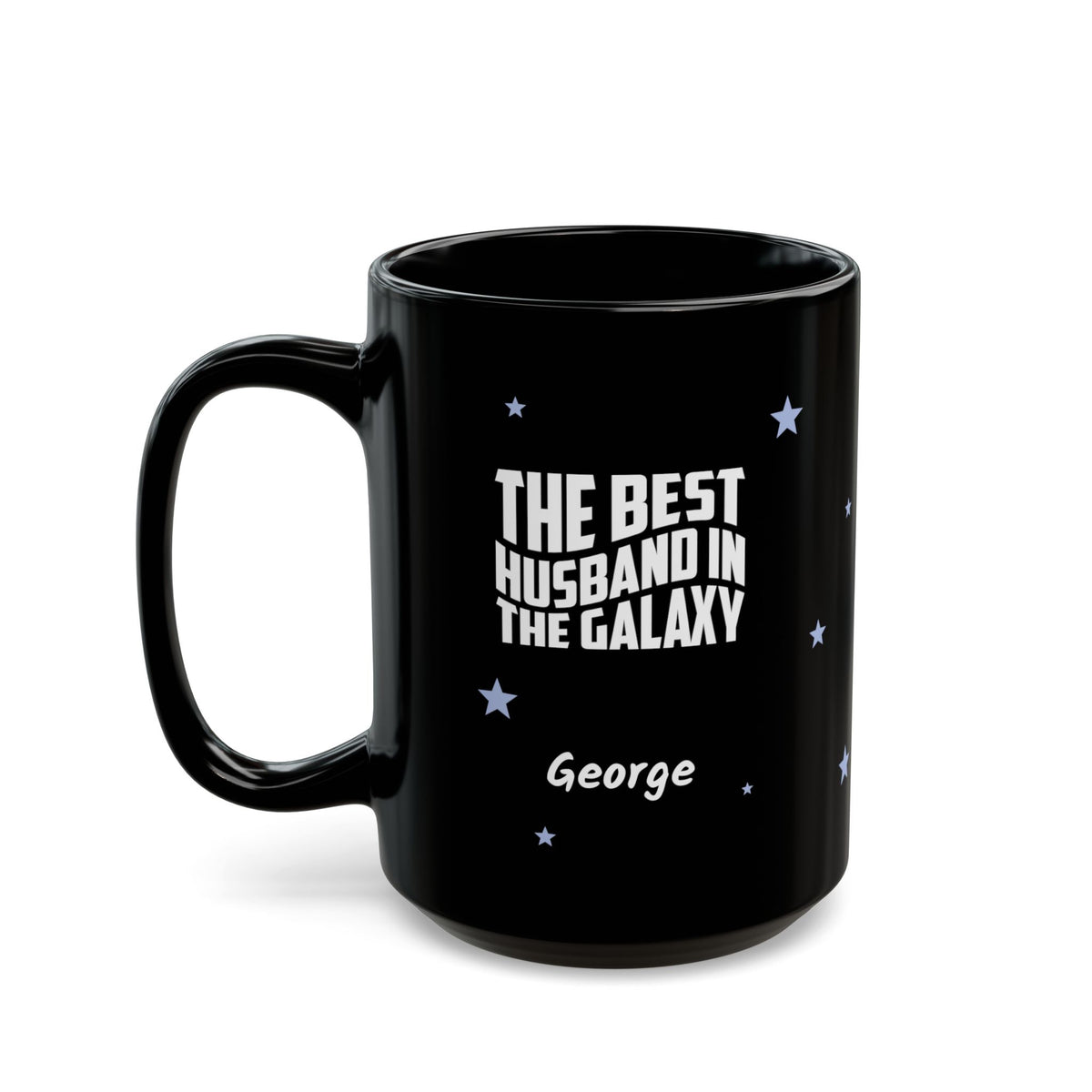 Black 15oz mug with small light blue stars and white text 'Best Husband in the Galaxy' with a personalize name below. Left handle view. Mug is placed on a white background