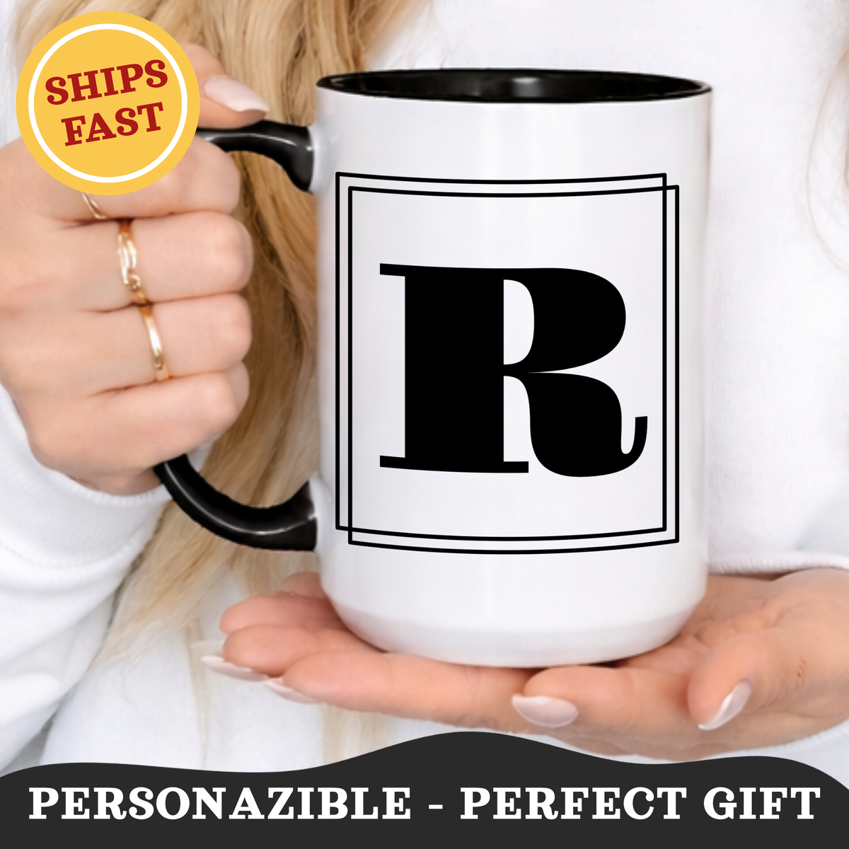 Person holding a personalized 15oz block letter monogram mug in black with a bordered initial.