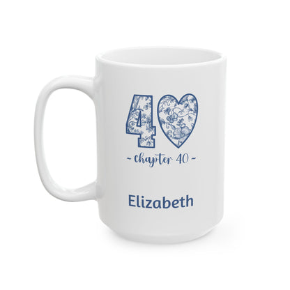 A white ceramic 15oz mug with a blue floral chinoiserie patterned design celebrating a 40th birthday, featuring a heart-shaped '40' and the name 'Elizabeth' printed in blue. Left handle view.