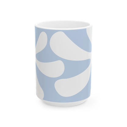 A white ceramic 15oz mug featuring a light blue and white abstract organic pattern, shown on a clean white background. Side view, handle not visible.
