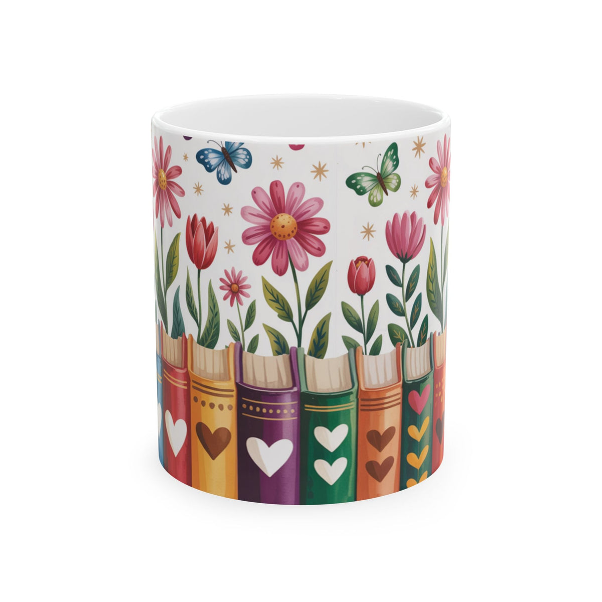 A white ceramic 11oz mug decorated with a whimsical pattern of colorful book spines, pink flowers, green leaves, and butterflies on a white background. No handle view.