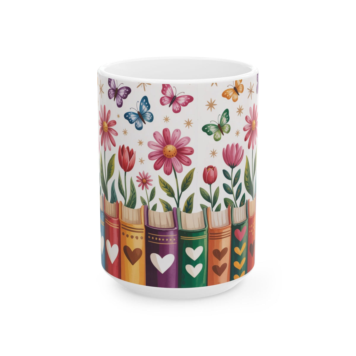A white ceramic mug decorated with a colorful pattern of flowers, butterflies, and book spines with hearts, shown on a clean white background. No handle view.