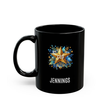 A black 11oz ceramic mug with a custom printed design featuring a gold star, blue floral accents, the text 'CEO' in the center, and personalized name 'JENNINGS' printed below in white. Left handle view. The mug is shown on a plain white background.