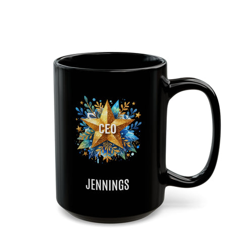 A black 15oz ceramic mug with a custom printed design featuring a gold star, blue floral accents, the text 'CEO' in the center, and personalized name 'JENNINGS' printed below in white. Right handle view. The mug is shown on a plain white background.