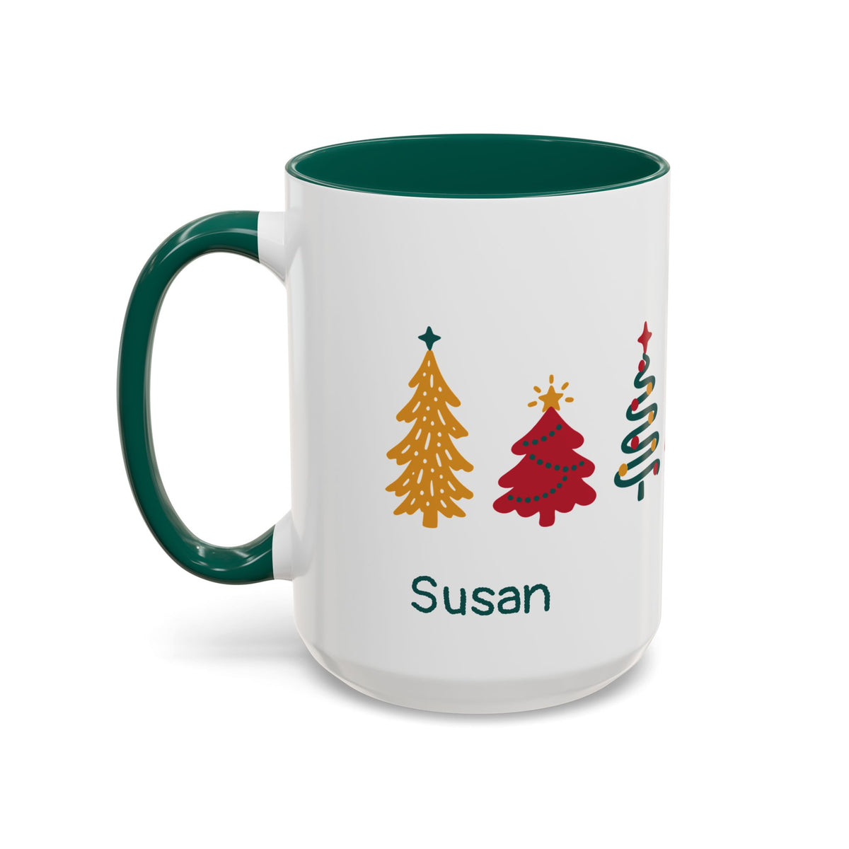 A white ceramic 15oz mug with a dark green handle and interior, featuring seven colorful Christmas tree illustrations around the mug and the name 'Susan' printed below. Left handle view.