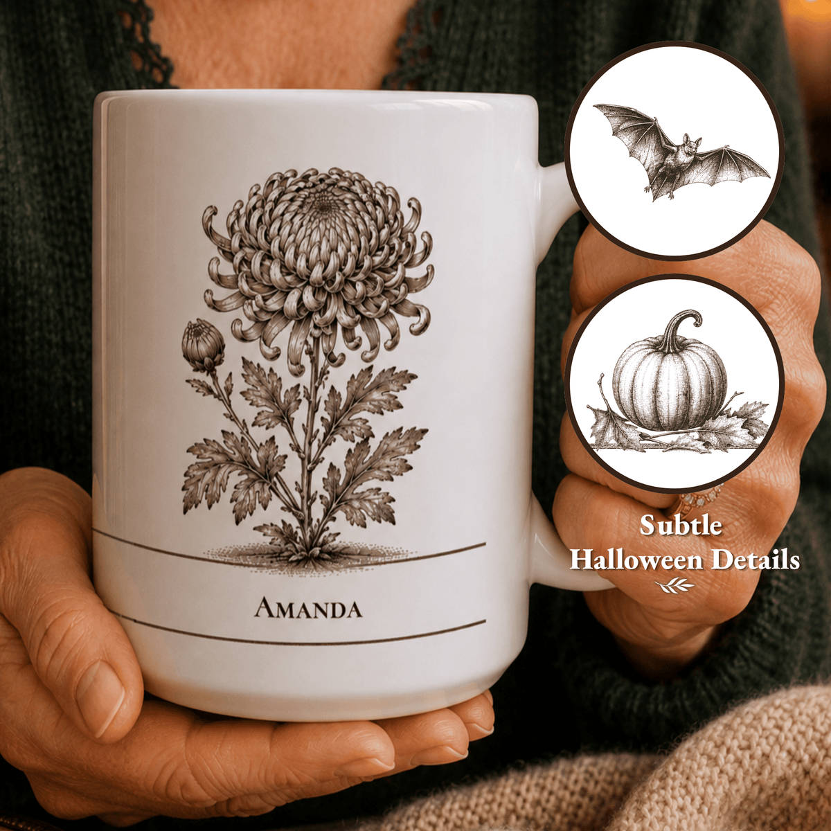 A person holds a white ceramic mug with a brown botanical illustration of a chrysanthemum and the name 'AMANDA' printed on it. Two circular inset callouts on the right show subtle Halloween-themed details: a bat and a pumpkin.