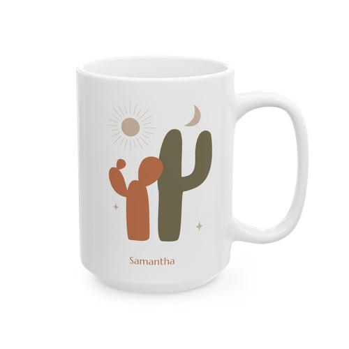 A white ceramic 15oz mug with a minimalist desert design featuring two cacti, a sun, a crescent moon, and the name 'Samantha' printed below, right handle view.