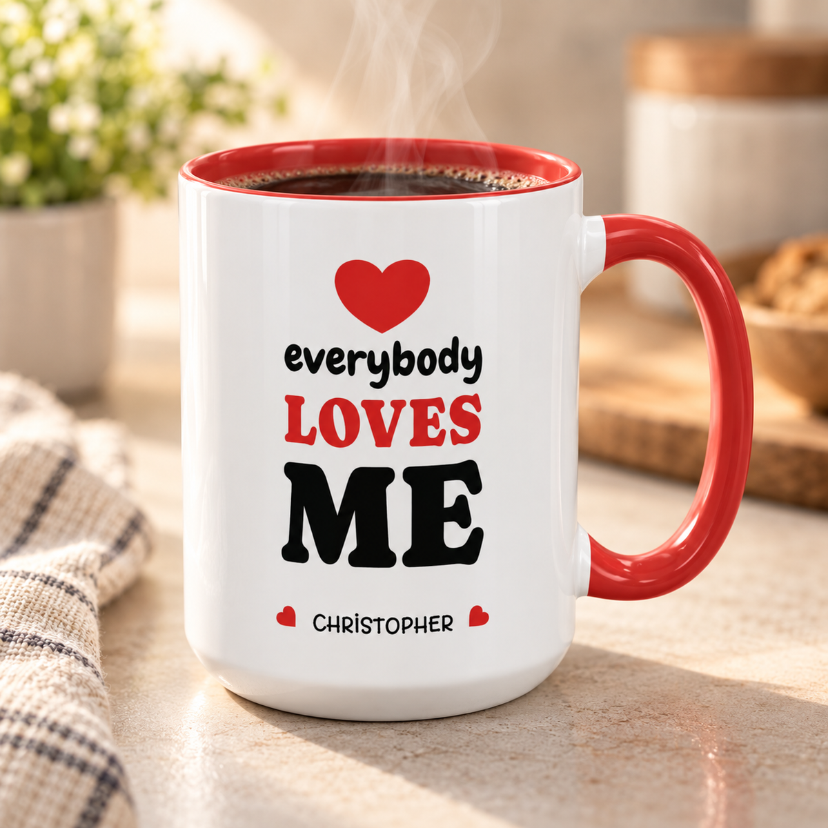 Red accent mug with 'everybody loves me' quote and personalized name, filled with coffee, lifestyle photo.