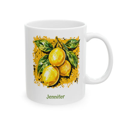 A white ceramic 11oz mug with a printed illustration of three yellow lemons with green leaves on a darker yellow textured background, and the name 'Jennifer' printed in green below. Right handle view.