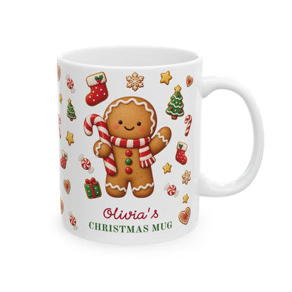 White ceramic 11oz Christmas mug with a gingerbread cookie, candy canes and the text 'Olivia's CHRISTMAS MUG'. Right handle view.