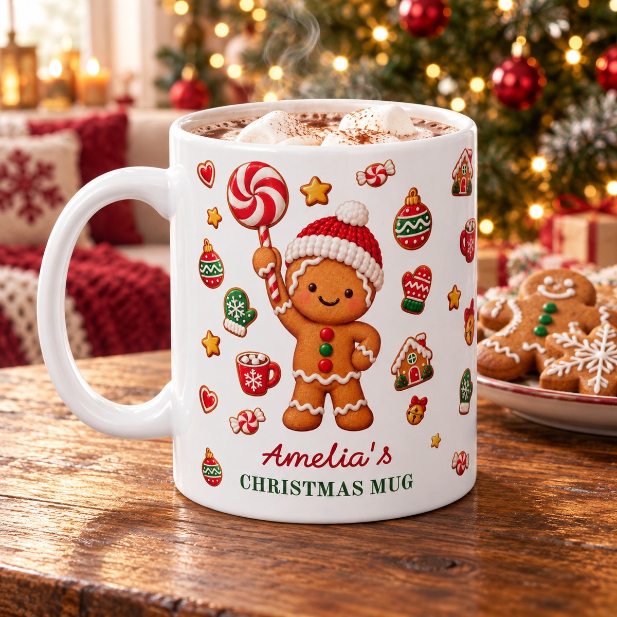 White ceramic 11oz gingerbread Christmas mug with hot cocoa and marshmallows on a wooden table, Christmas tree behind.