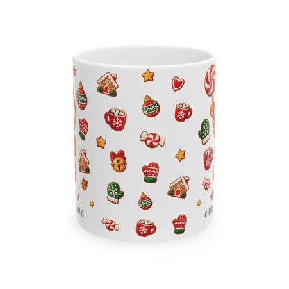 White ceramic 11oz mug with a Christmas pattern of gingerbread houses, cocoa cups, mittens and ornaments. Handle not visible.