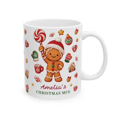White ceramic 11oz gingerbread Christmas mug with festive cookies and the text 'Amelia's CHRISTMAS MUG'. Right handle view.