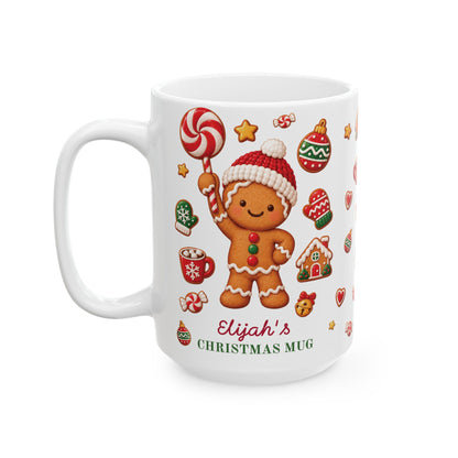 White ceramic 15oz Christmas mug with a gingerbread cookie holding a lollipop and the text 'Elijah's CHRISTMAS MUG'. Left handle view.
