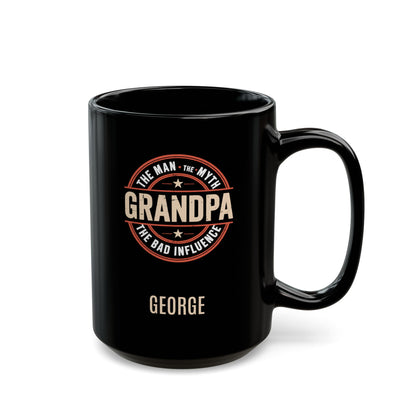 Black 15oz mug with 'Grandpa: The Man, The Myth, the Bad Influence' text and personalized name below. Right handle view. Mug is placed on a white background
