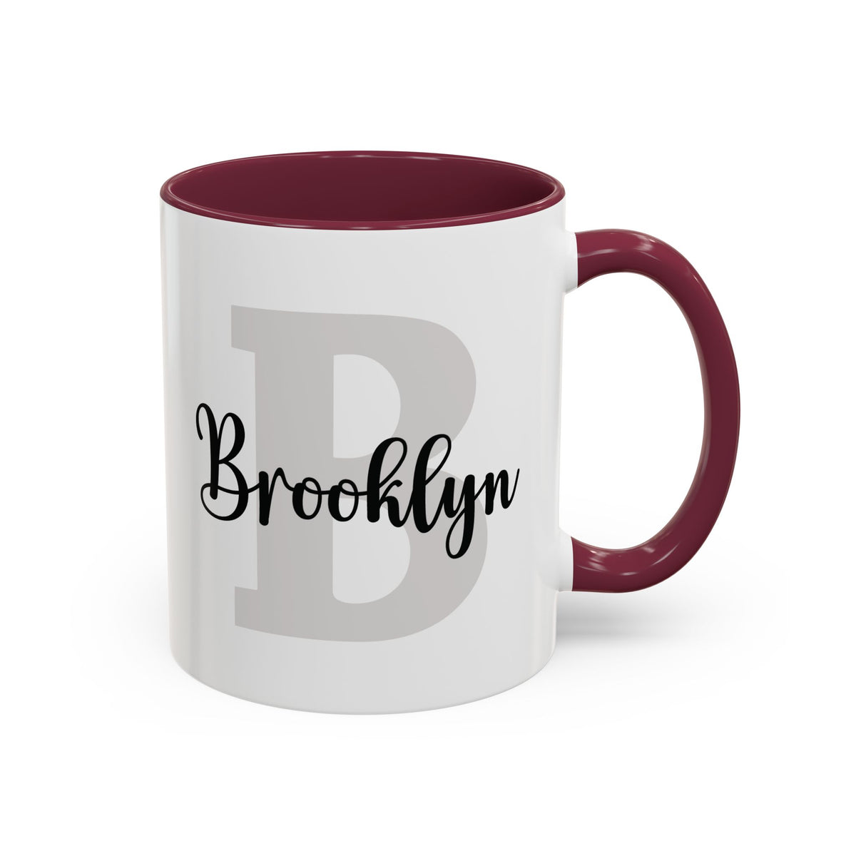 Personalized layered name and initial ceramic mug 11oz with a maroon accent inside and handle, studio product photo. Right handle view