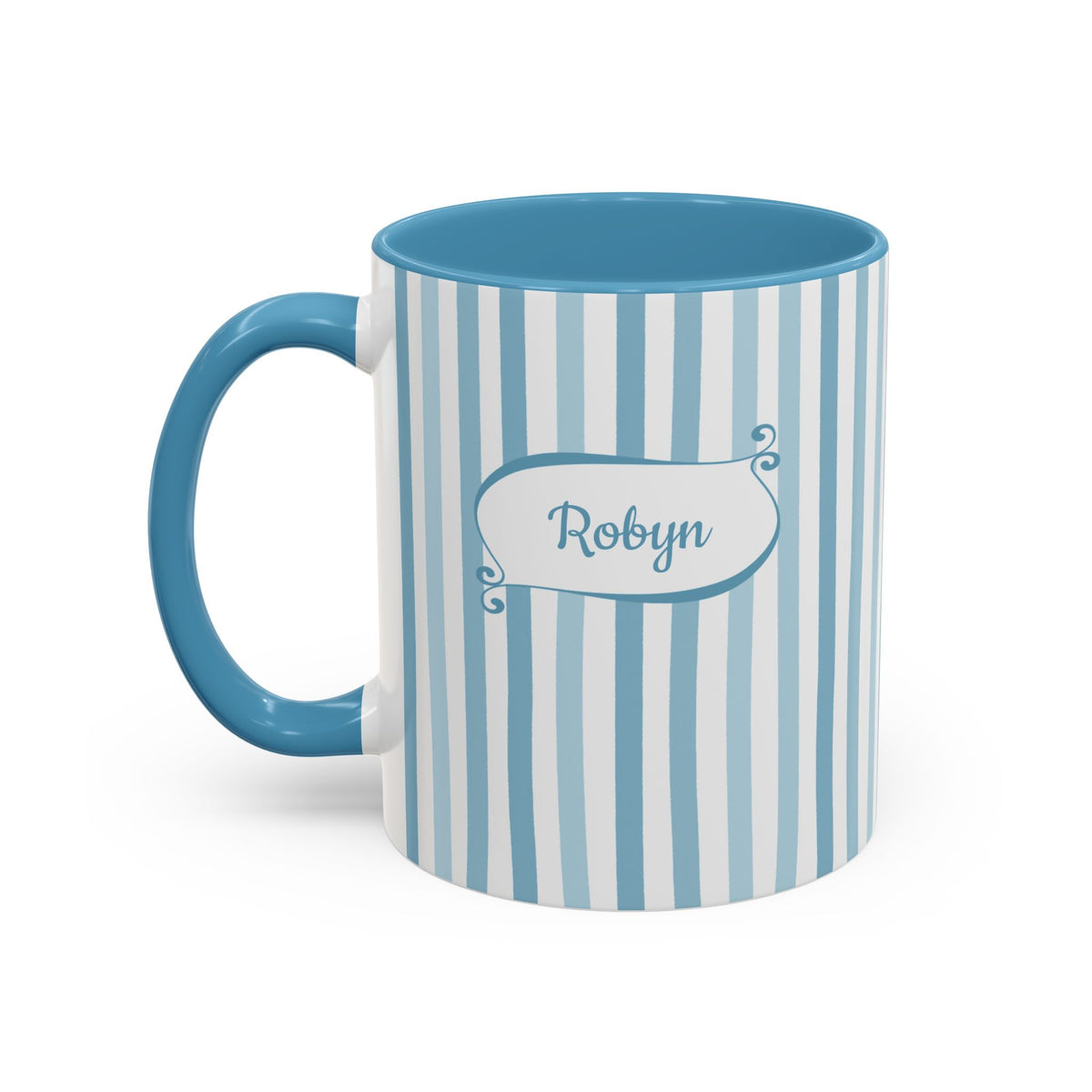 A ceramic 11oz mug with a light blue and white vertical stripe pattern, a solid light blue handle, and a light blue interior. The front features a light blue label with the name 'Robyn' in light blue script. Left handle view.