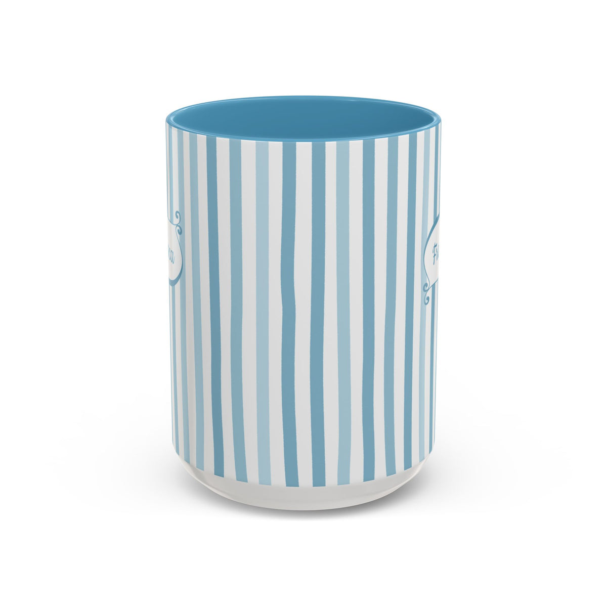 Side view of a white ceramic 15oz mug with a vertical stripe pattern in light blue, medium blue, and white, featuring a solid medium blue interior and a frosted clear base, shown on a white background. No handle visible.