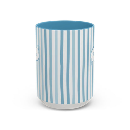 Side view of a white ceramic 15oz mug with a vertical stripe pattern in light blue, medium blue, and white, featuring a solid medium blue interior and a frosted clear base, shown on a white background. No handle visible.