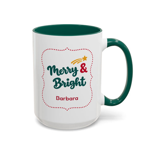 A white ceramic 15oz mug with a dark green handle and interior, featuring a festive graphic in thick script lettering that reads 'Merry & Bright' with a red dotted border, a small yellow shooting star, and the name 'Barbara' printed below. Right handle view.