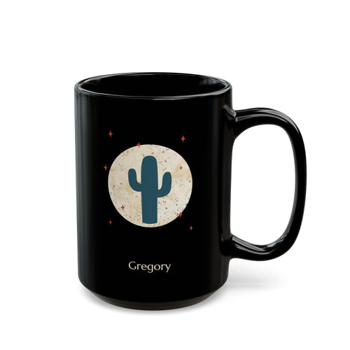 A 15oz glossy black ceramic mug, featuring a printed graphic of a teal cactus inside a beige circle with small red stars, and the name 'Gregory' printed below, right handle view.