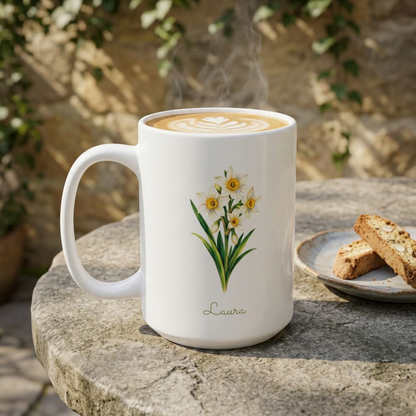 Narcissus birth flower personalized ceramic mug, styled on a stone table with biscotti on plate and vines against a wall in background.