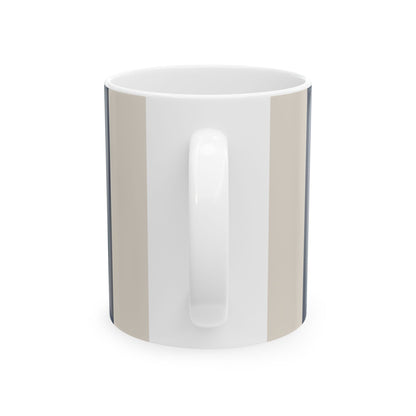 Handle view of a white ceramic 11oz mug with a vertical striped pattern in beige, navy and white, on a white background.