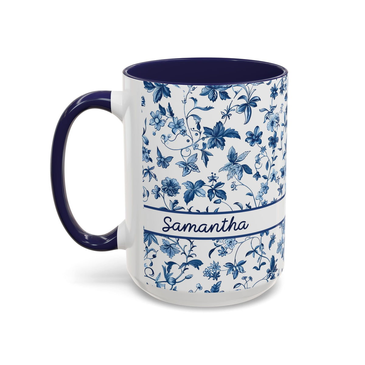 A white ceramic 15oz mug with a navy blue floral chinoiserie pattern, a navy blue handle and interior, and a white band around the middle featuring the name 'Samantha' in script. Left handle view.