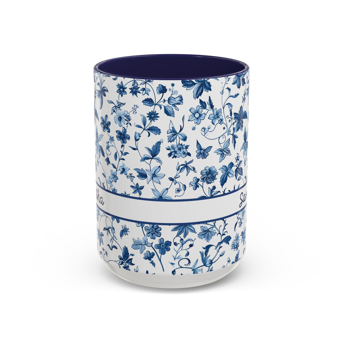 A ceramic 15oz cup with a blue floral chinoiserie pattern on a white exterior and a solid dark blue interior, shown against a plain white background. Handle not visible.