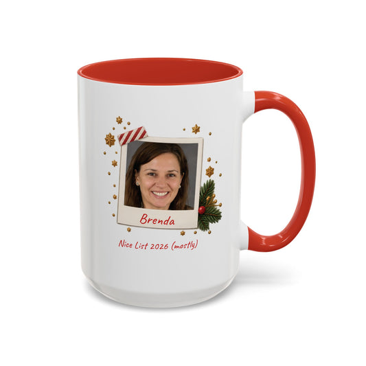 A white ceramic 15oz mug with a red interior and red handle, featuring a custom printed holiday polaroid photo frame design with the name 'Brenda' and the text 'Nice List 2026 (mostly)'. Right handle view.