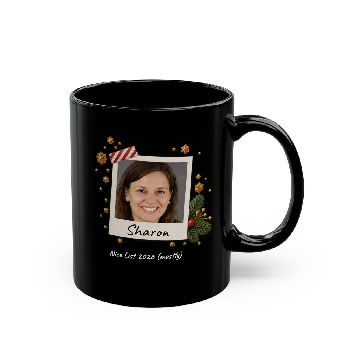 A black ceramic 11oz mug with a custom photo print on the front, featuring a portrait labeled 'Sharon' and the text 'Nice List 2026 (mostly)' on a white background. Right handle view.