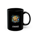 A black ceramic mug with a custom printed design featuring a gold star, blue floral accents, the text 'CEO' in the center, and 'JENNINGS' printed below in white, shown on a plain white background.