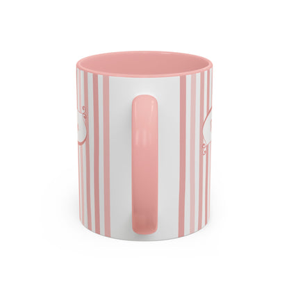 Handle view of a white ceramic 11oz mug with vertical pink and white stripes, a solid pink handle and interior, and a white base.