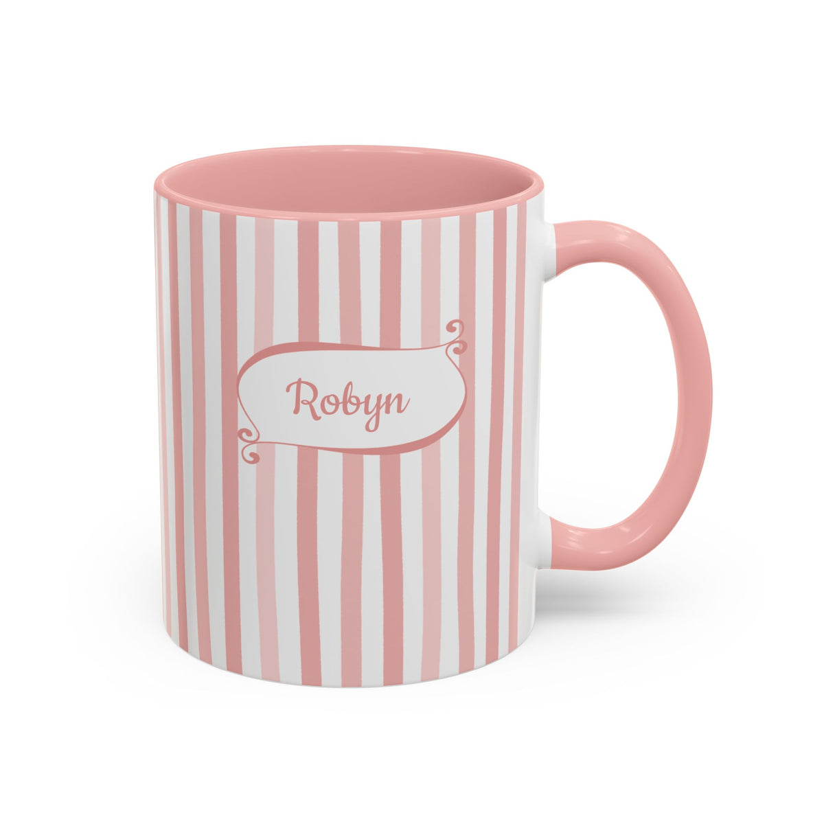 A pink and white striped ceramic 11oz mug with a pink handle, featuring a white label on the front with the name 'Robyn' in pink script. Right handle view.