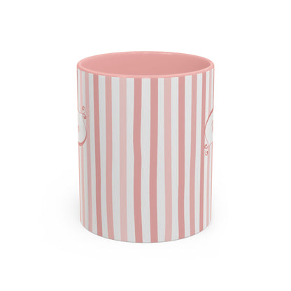 Side view of a white ceramic 11oz mug with a vertical pink and white stripe pattern, featuring a solid pink interior, shown on a clean white background. Handle not visible.