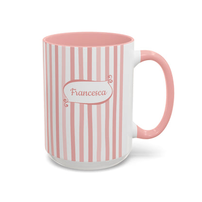 A ceramic 15oz mug with vertical pink and white stripes, a solid pink handle and interior, and a white base. The front features a white label with pink border and the name 'Francesca' in pink script. Right handle view.