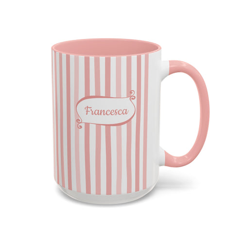 A ceramic 15oz mug with vertical pink and white stripes, a solid pink handle and interior, and a white base. The front features a white label with pink border and the name 'Francesca' in pink script. Right handle view.