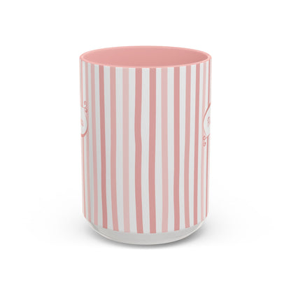 Side view of a white ceramic 15oz mug with a vertical pink and white stripe pattern, featuring a solid pink interior, shown on a clean white background. Handle not visible.