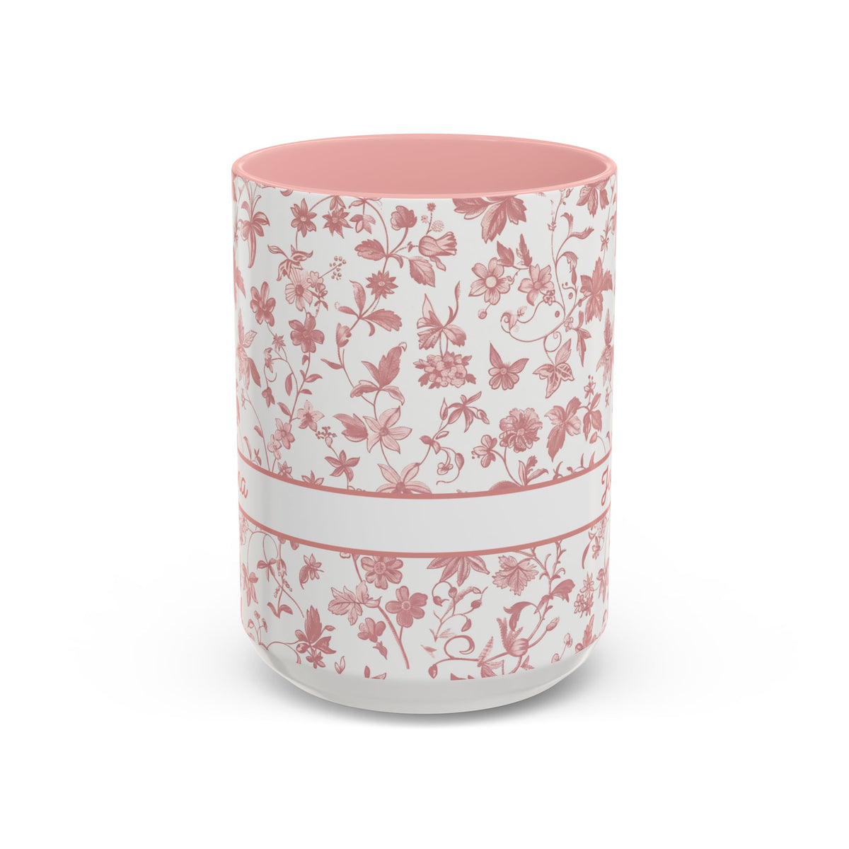 A white ceramic 15oz mug with a pink floral chinoiserie pattern, a pink handle, and a pink interior. A white band around the middle. Handle not visible.