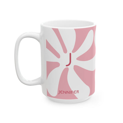 A white ceramic 15oz mug featuring a pink retro sunburst design with a red monogram letter 'J' in the center and the name 'JENNIFER' printed in red near the bottom. Left handle view.