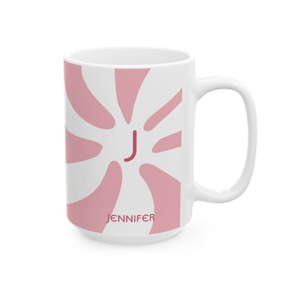 A white ceramic 15oz mug featuring a pink retro sunburst design with a red monogram letter 'J' in the center and the name 'JENNIFER' printed in red near the bottom. Right handle view.