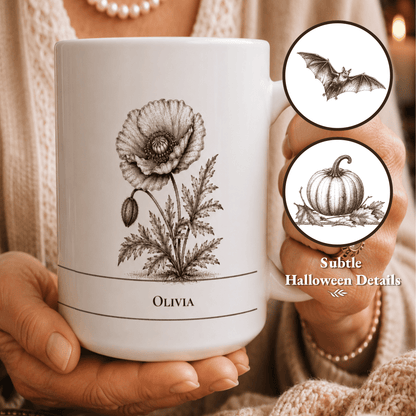 A person holds a white ceramic mug with a black vintage-style poppy illustration and the name 'OLIVIA' printed near the bottom. Two circular inset callouts on the right show additional subtle Halloween-themed line drawings, including a bat and a pumpkin.