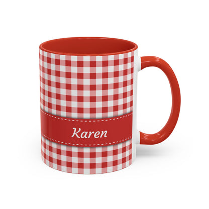 A white ceramic 11oz mug with a red and white gingham check pattern, a solid red handle and interior, and a red horizontal band around the middle featuring the name 'Rebecca' in white script. Right handle view.