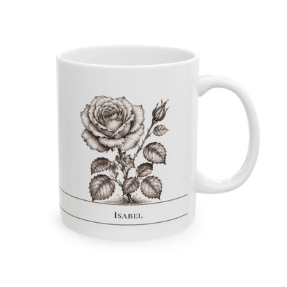 A white ceramic mug featuring a detailed black and white rose illustration with the name 'ISABEL' printed below, set against a plain white background.